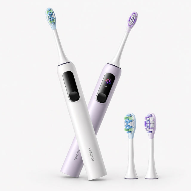 Set of electric toothbrushes with purple handles, white bodies, and blue bristle heads