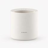 White Xiaomi smart scent diffuser with top controls, cylindrical aroma device