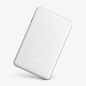 Portable photo printer Pro, white slim device with Xiaomi logo on the back.