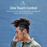 Black wired earbuds in an ear with braided cable