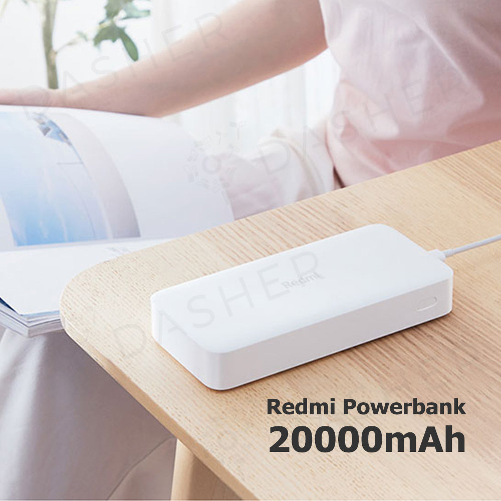 White Redmi 20000mAh power bank on tabletop with charging cable